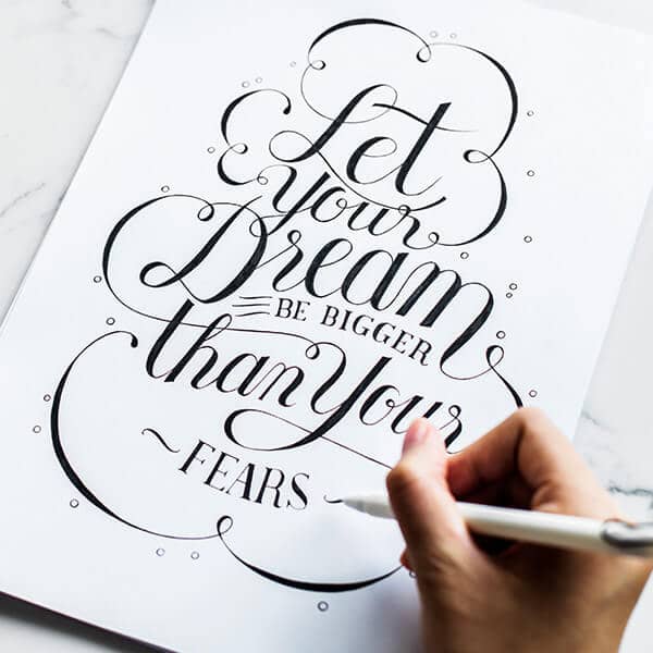 Hand lettering that reads Let your dream be bigger than your fears